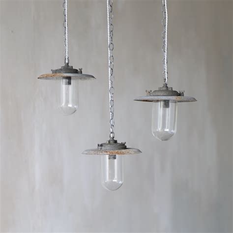 A set of three industrial pendant lights