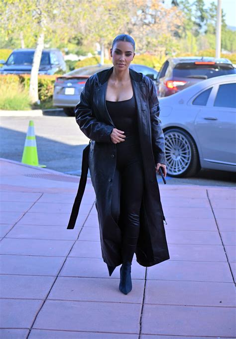 Kim Kardashian spills out of bodysuit but covers up her shrinking butt ...