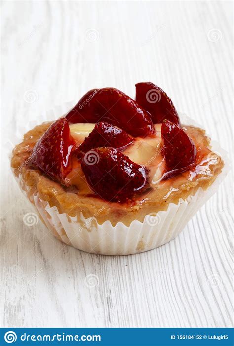 Strawberry Vanilla Cream Cheese Tart On A White Wooden Surface Side