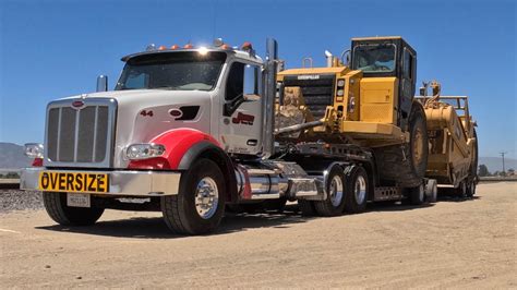 CAT 637 G & E Gettin picked up after a months work - YouTube
