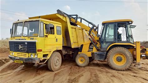 Jcb Dx Backhoe Loading Red Mud In Tata Truck Jcb Loading Mud