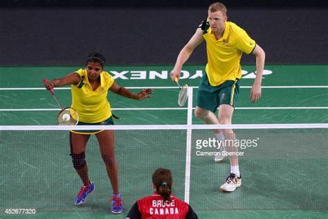 Renuga Veeran And Ross Smith Of Australia Play A Shot During Their