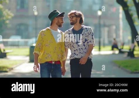 Close Up Two Gay Men Walking Look To Each Other In Eyes Holding Hands Homosexual Couple Dating