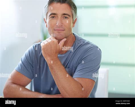 He Exudes Confidence Portrait Of A Handsome Mature Man Relaxing At Home Stock Photo Alamy