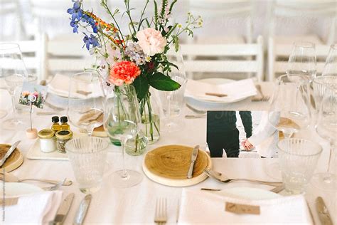 Table Set Up For A Wedding With Flowers And Cards By Stocksy