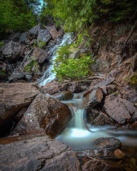 Water Cascading Down A Secluded Waterfall In Terra Nova National Park