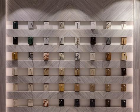 The Wall Is Made Up Of Many Different Types Of Marbles And Metal Bars