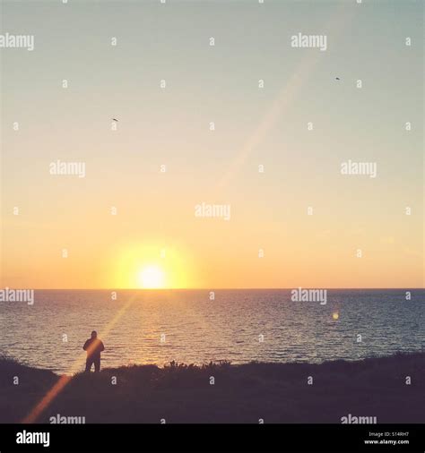 Man Watching Sunset Stock Photo Alamy