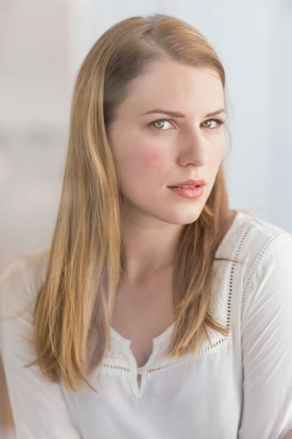 Premium Photo Portrait Of A Blonde Woman Posing Looking At Camera