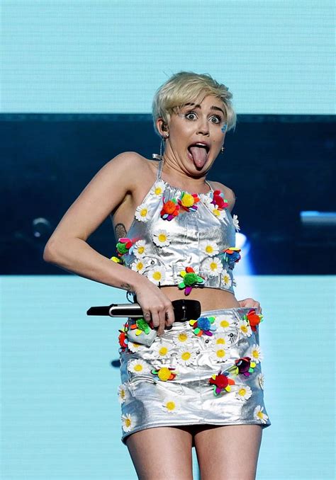 Miley Cyrus Wears Saucy High Cut Leotard And Blonde Wig To Spit Over Fans The Mirror