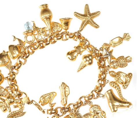 9ct Gold Charm Bracelet With 27 Assorted Charms