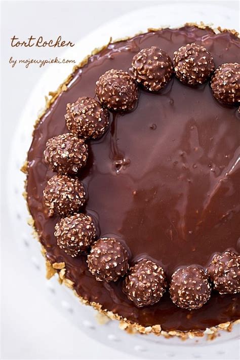 A Chocolate Cake Sitting On Top Of A White Plate