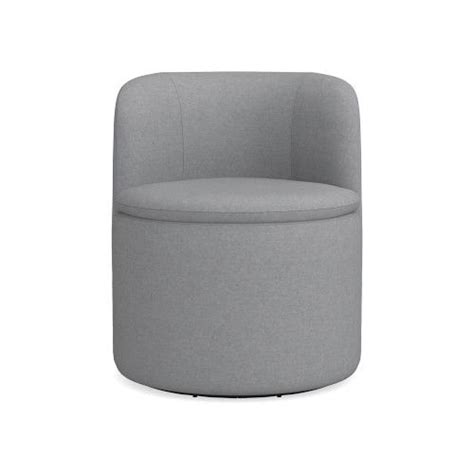 a grey chair with a round seat and foot rest on the bottom, in front of ...