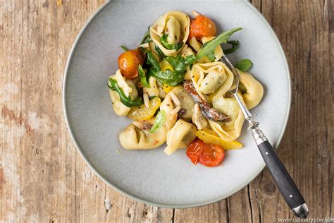 Tortelloni Spinat Ricotta Mit Sardellen Orangenfilets Tomaten Rucola