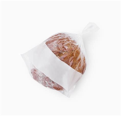 Premium Photo Freshly Baked Loaf Of Bread In A Plastic Bag With A