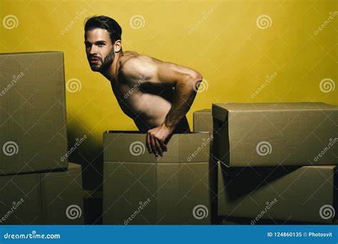 Guy With Naked Torso Sits Among Boxes Delivery And Moving Stock Image Image Of Deliveryman