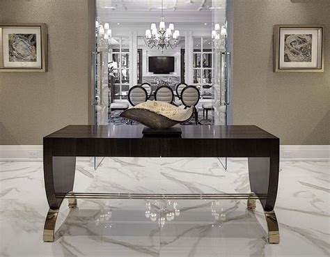 An Elegant Dining Room With Marble Flooring And Chandelier