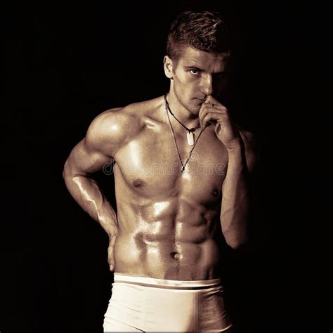 A Guy With A Naked Torso In White Trunks A Monochrome Photo Stylized As A Film Stock Photo