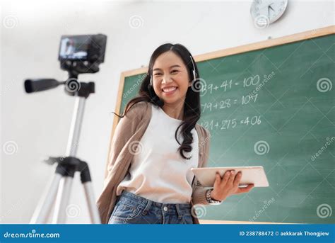 Happy Smiling Asian Female Teacher Doing Online Teaching On Camera And