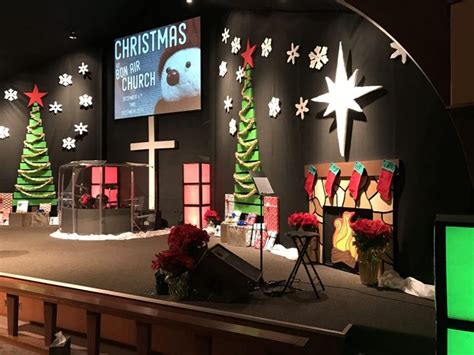 a church stage decorated with christmas decorations