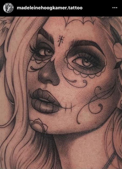 A Woman S Face Is Covered In Tattoos