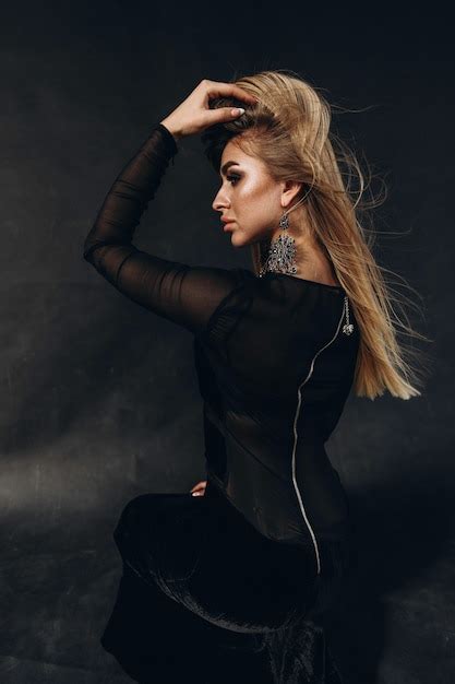 Premium Photo Blonde Girl In Black Dress Posing