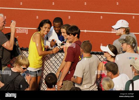 Tyson Gay Takes Photos With Fans After Winning The Men S 100 Meter Final With A Wind Assisted