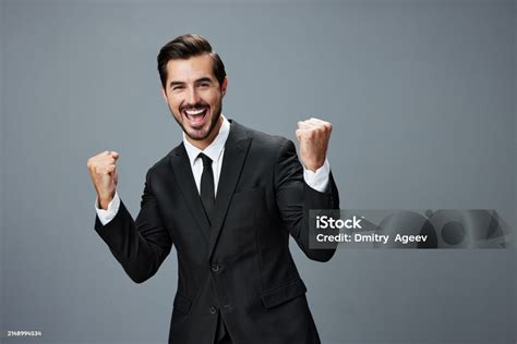 Man Businessman Smiles With Teeth And Raised His Hands Up Clenched