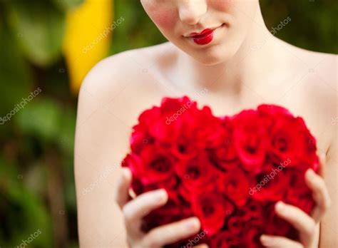 Nude Girl Holding A Red Roses Heart In A Garden Stock Photo By Mjth