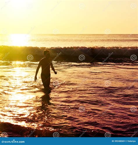 Silhouette Of Man On The Beach At Sunset Stock Image Image Of Moody