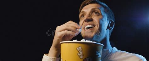 Smiling Man Watching A Movie And Eating Popcorn Stock Image Image Of