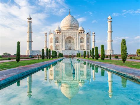 Amazing View On The Taj Mahal In Sunset Light With Reflection In Water