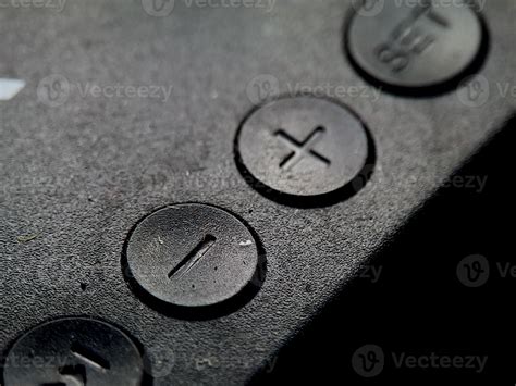 textured black surface features  buttons  imprinted shapes