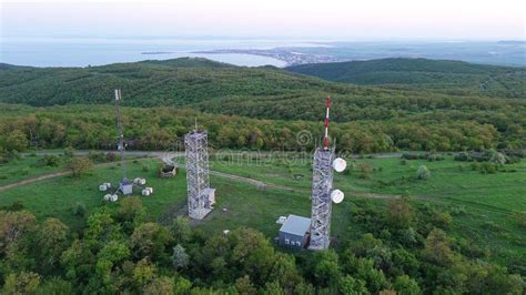 View Of The Hills Covered With Vegetation With Cell Towers Against The