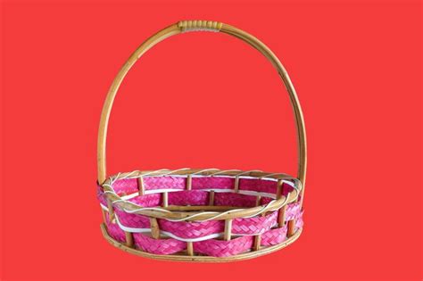 Premium Photo Wicker Basket With Pink Ribbon On Table