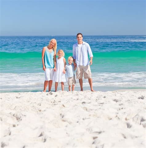 Portrait Of A Family On The Beach Stock Image - Image of daughter