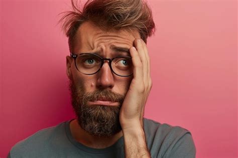 Premium Photo A Man With A Beard And Glasses Covering His Face