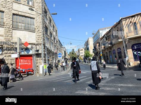 Pedestrians crossing the road at the ultra-Orthodox neighborhood of ...