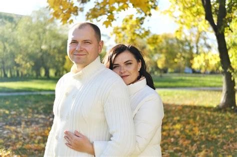 Premium Photo Husband And Wife In White Warm Clothes Posing For The