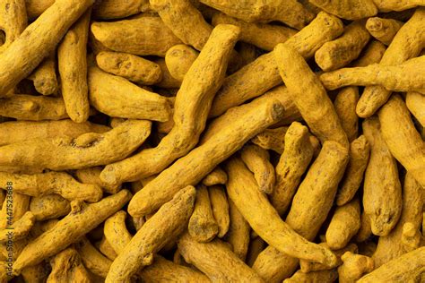 dried yellow turmeric close  full frame   background stock photo