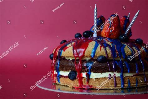 The Triple Layer Naked Cake With Small Blueberries Pressed Along Perimeter And Sides Dramatic