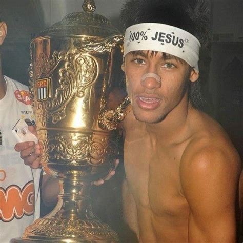 Two Shirtless Men Holding Up A Trophy