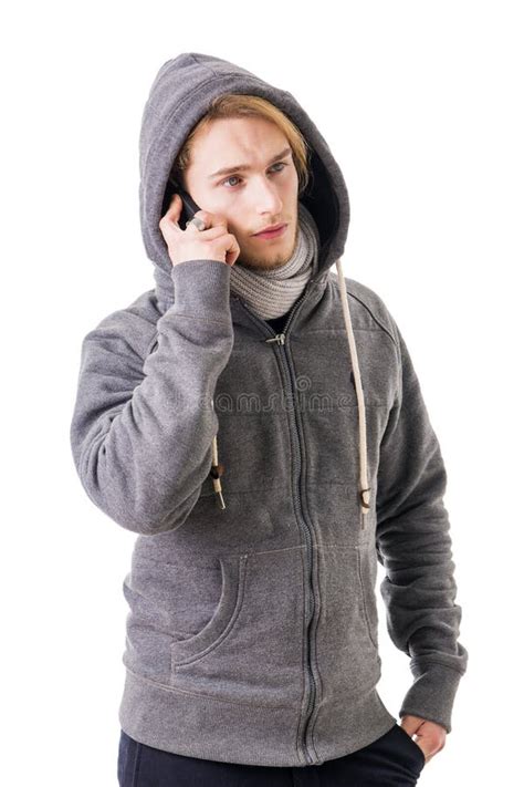 Attractive Young Blond Man Hiding Half Face Behind Wall Stock Image