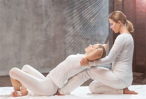 Professional Masseur Doing Thai Massage Therapist Is Making Body