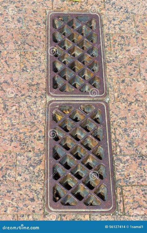 Old Rusty Sewer Drain At A Parking Ramp Stock Photo Image Of Manholes