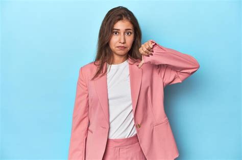 Premium Photo Teen Girl In Chic Pink Suit On A Blue Background