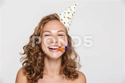 Image Of Happy Half Naked Woman With Party Cone And Whistle Laughing