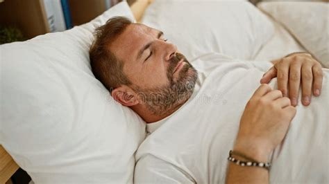 Handsome Mature Man With Grey Hair Sleeping Peacefully In A White Bedroom Stock Photo Image Of