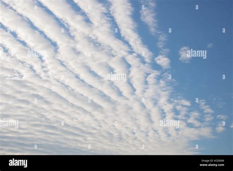 Altocumulus stratiformis undulatus clouds Stock Photo - Alamy