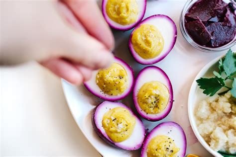 Vegetarian Passover Seder Plate With Beet Pickled Deviled Eggs Kale And Caramel